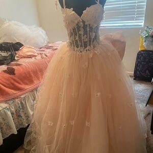 Quinceañera Dress light pink with butterfly’s with a train, bow and a corset